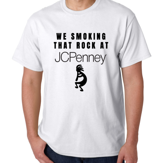 White T-Shirt with text we smoking that rock at J C Penny then under the text a black silhouette  image of Kokopelli