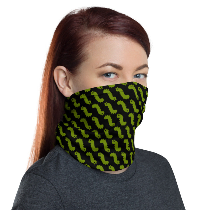 woman wearing pull up gaiter style face mask with repeating green bug emoji pattern